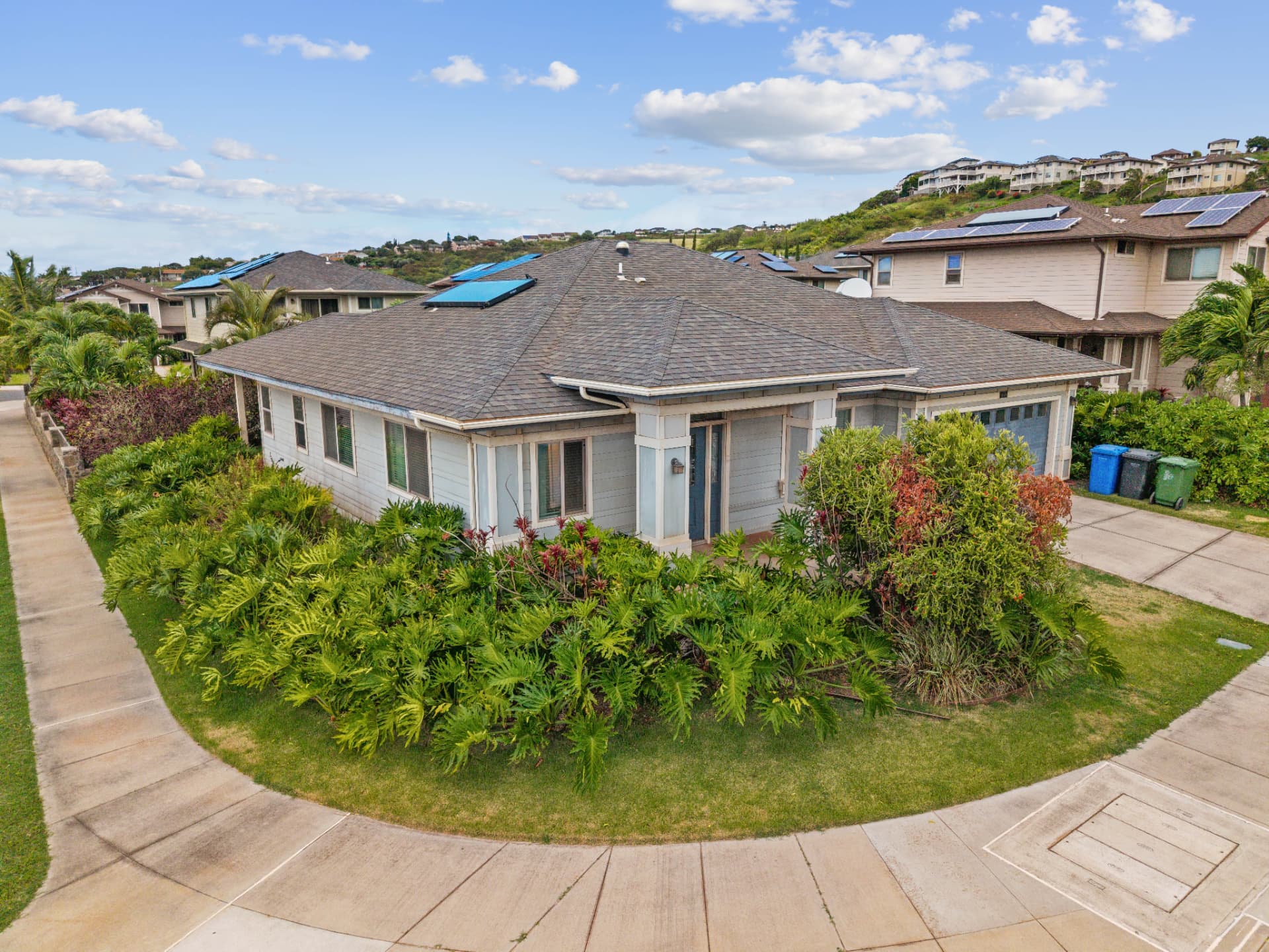 Aerial front view of the single-level home at 92-714 Welo St on its Kahiwelo corner lot